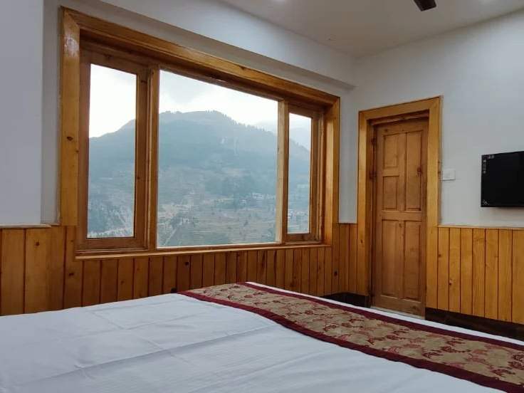 Windows looking over the mountain valley near Sach Pass